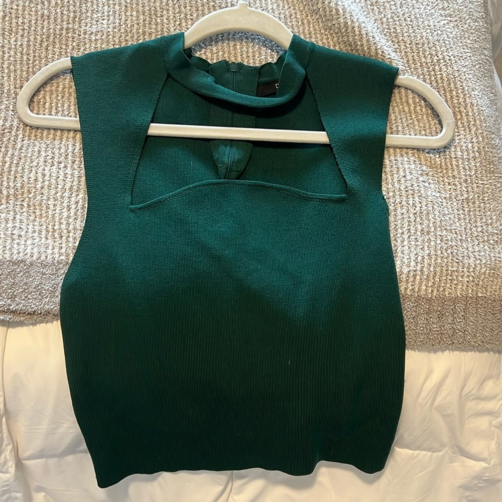 green sleeveless top